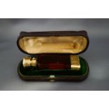 A silver gilt, red glass combination vinaigrette scent bottle, by Sampson Mordan & Co, London 1874,