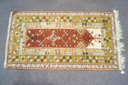 A 20th century Anatolian wool and cotton multi coloured rug,