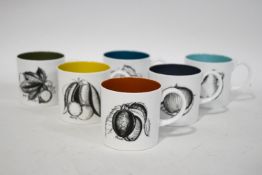 A Susie Cooper set of six coffee cups and saucers, and one side plate,