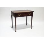 An 18th century oak side table with single drawer, upon rounded tapering legs and pad feet,