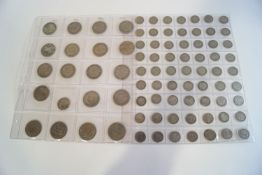 A collection of English coinage, including Victorian pennies, half pennies, shillings, sixpences,
