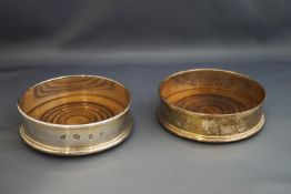 A pair of silver wine bottle coasters, London 1973, the mounts with feature hallmarks,