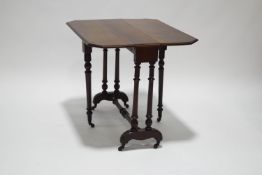 A Victorian mahogany Sutherland table on turned legs,