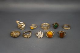 A collection of ten silver and silver coloured rings