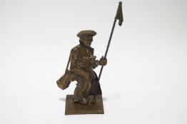 A brass firesside companion set cast as a golfer, with poker and shovel,