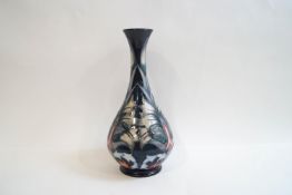 A Moorcroft vase with slender flared neck and bulbous body,