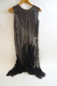 A 1920s style beaded and black lace dress, 120cm long,