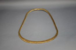 A 9 carat four colour gold collarette, 42 cm long,