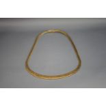 A 9 carat four colour gold collarette, 42 cm long,