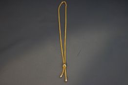 An 18 carat gold two tassel drop necklace, 41 cm long, 14.