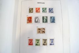A collection of Netherlands stamps in a Davo album, including 1852-53 and 1864 sets, 1867 5c to 50c.