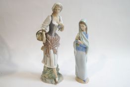 A Lladro figure of a Country lady with a basket of flowers, 29.