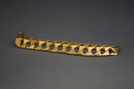 A bracelet, tagged 9 carat, of filed textured links, 11.