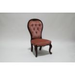 A pair of mahogany button backed nursing chairs,