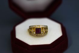 A synthetic ruby and diamond ring, indistinct marks, the square cut stone enclosed by single cuts,