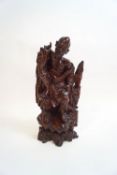 A Chinese carved hardwood figure of an emaciated elderly man,