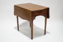 A 19th century mahogany pembroke tea table, having shaped flaps,