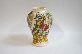 A Moorcroft baluster vase, tube lined with 'Golden Lily' pattern, designed by Rachel Bishop,
