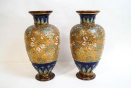 A pair of Royal Doulton stoneware vases of baluster form,