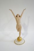A Lorenz Hutschenreuther bisque porcelain figure of a nude lady with outstretched arms upon a
