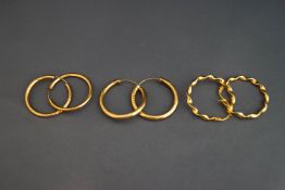 A pair of 9 carat gold hoop earrings; and another pair stamped '375'; 2.
