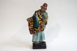 A Royal Doulton figure: The Carpet Seller, HN1464, 22.