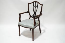 An 18th century mahogany and satinwood strung elbow chair,