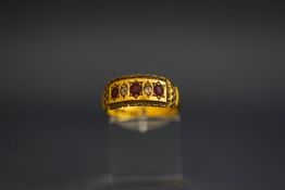 An Edwardian 18 carat gold diamond and ruby set ring, Chester 1905, finger size O, 3.
