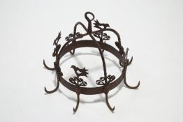 A Victorian wrought iron game carrier, in the form of a 'crown' with scrolls and bird detail,