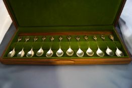A set of twelve silver Royal Horticultural Society Flower spoons, by John Pinches, Sheffield 1975,