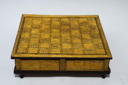 A 20th century matchstick inlaid chessboard with painted landscape decoration to the sides,