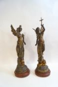 A pair of French bronzed spelter figures of winged females in military attire,