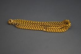 A three strand bracelet, of reeded round links,