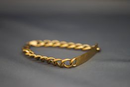 A 9 carat gold identity bracelet, with curb links, 21.5 cm long, 14.