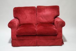 A Laura Ashley two seater sofa in the Padstow design with cranberry upholstery, 134cm wide,