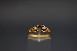 A ring mount, stamped '750',
