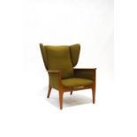 A Parker Knoll wing back armchair with green upholstery, 78cm at widest point,