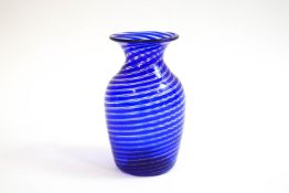 A 19th century French glass vase of blue and gold swirl design,