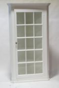 A large painted pine corner cabinet with astragal glazed doors,
