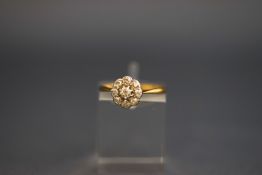 A nine stone diamond cluster ring, indistinct marks, the old cut diamonds totalling approximately 0.