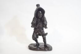 A 20th century Japanese bronze figure of a peasant wearing a straw hat, signature to base,