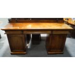 A Victorian mahogany sideboard with three drawers over two cupboards,