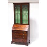 An early 19th century mahogany bureau bookcase,