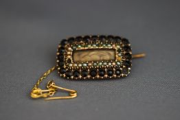 A mourning brooch, with a hair panel, inscribed for 1818, 2.