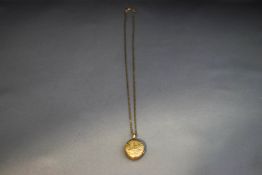 A Victorian gilt metal locket,