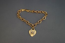 A 9 carat gold bracelet, of hollow links, with a heart shaped initial M charm,