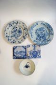 Two 18th century tin glazed earthenware blue and white dishes, two 18th century Delft tiles,