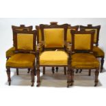 A set of seven Victorian dining chairs with mahogany show frame on turned fluted and reeded legs,