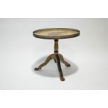 A painted occasional table, the circular top with rose decoration within a brass gallery,