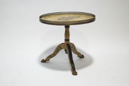 A painted occasional table, the circular top with rose decoration within a brass gallery,